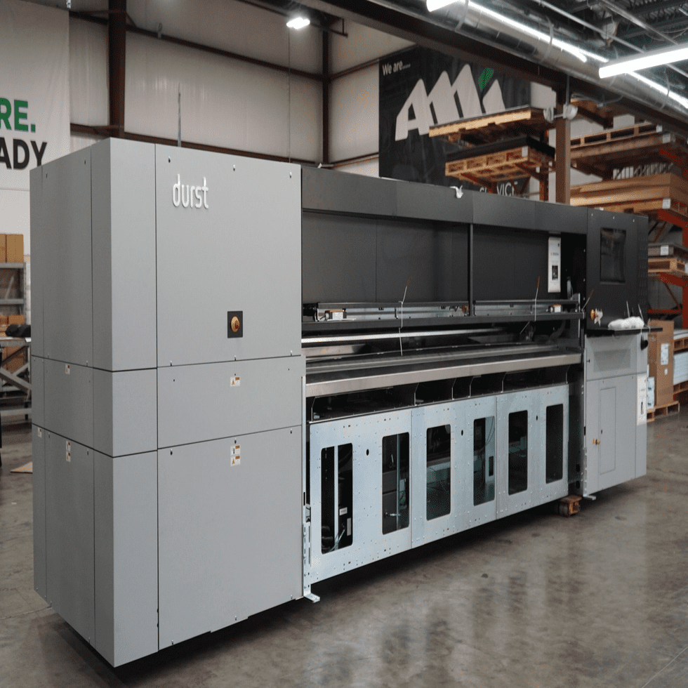 Large industrial digital printing machine in a warehouse setting